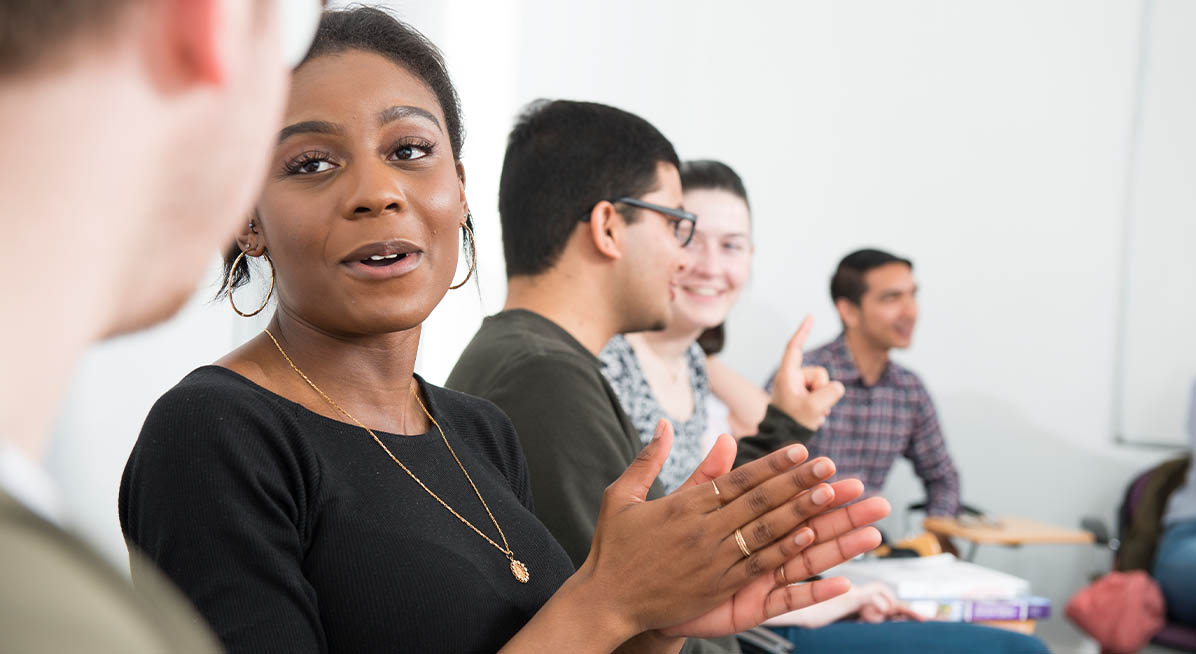 Students chat during a seminar